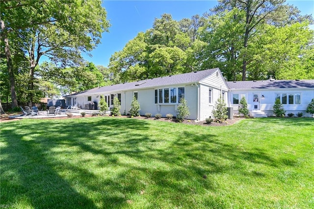 5227 Lake Shores Rd, Virginia Beach, VA 23455 - back of house featuring a patio area, a yard, and brick siding