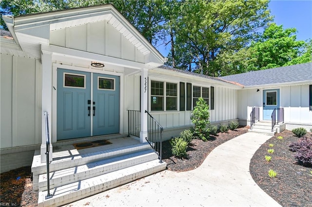 5227 Lake Shores Rd, Virginia Beach, VA 23455 - doorway to property with board and batten siding and a shingled roof