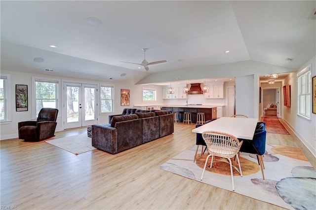 5227 Lake Shores Rd, Virginia Beach, VA 23455 - living room featuring vaulted ceiling, light wood-style floors, a ceiling fan, french doors, and stairway