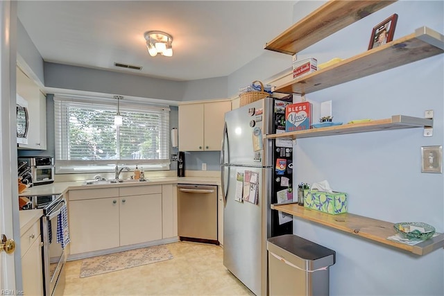 1118 Glengarry Way, Virginia Beach, VA 23451 - kitchen with stainless steel appliances, open shelves, and cream cabinets