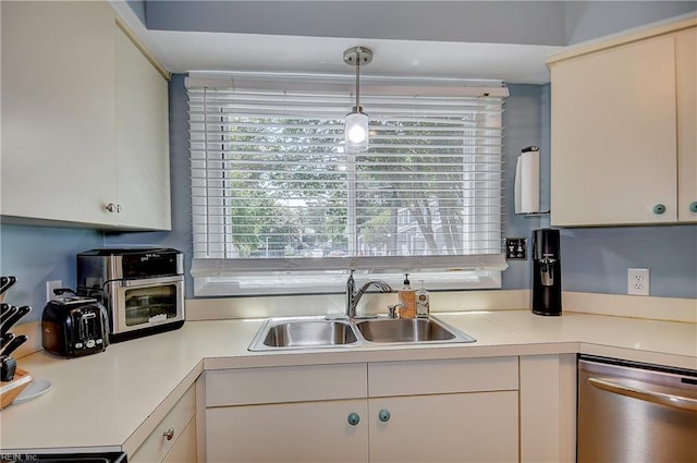 1118 Glengarry Way, Virginia Beach, VA 23451 - kitchen featuring stainless steel dishwasher, light countertops, white cabinetry, and hanging light fixtures