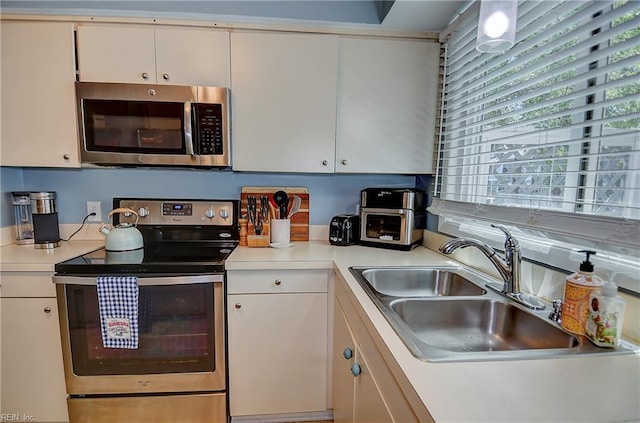1118 Glengarry Way, Virginia Beach, VA 23451 - kitchen with stainless steel appliances, light countertops, and white cabinetry