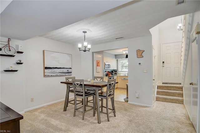1118 Glengarry Way, Virginia Beach, VA 23451 - dining area featuring light carpet, a chandelier, and stairway