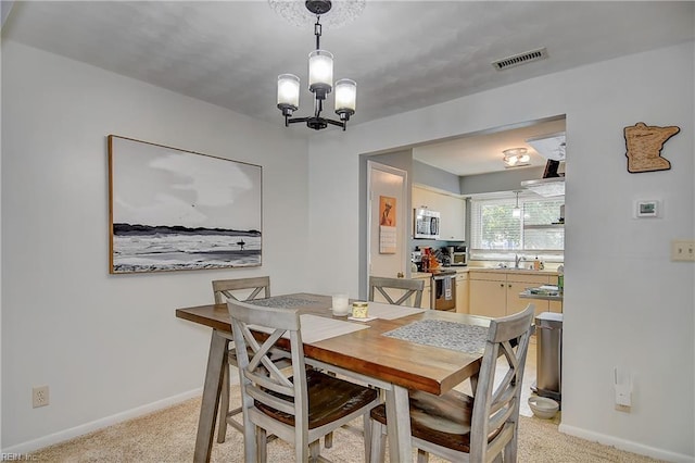 1118 Glengarry Way, Virginia Beach, VA 23451 - dining area featuring a chandelier and light carpet