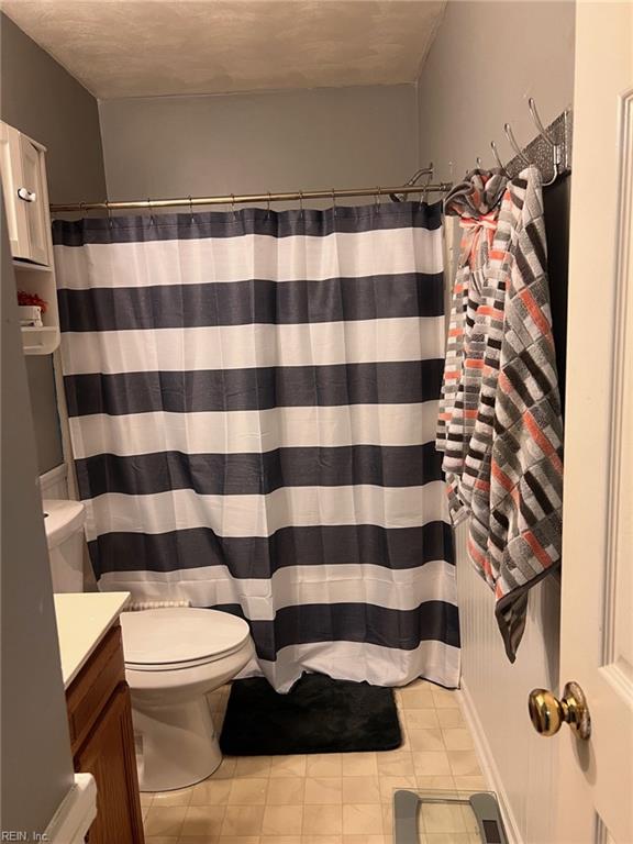 222 Greenfield Cres, Suffolk, VA 23434 - full bathroom with toilet, vanity, tile patterned floors, and a shower with curtain