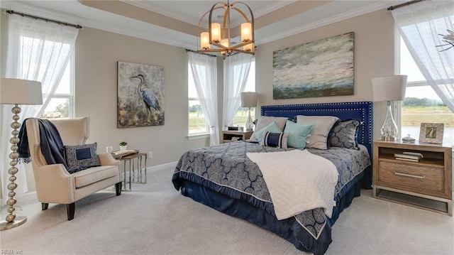 242 Quarter Horse Loop, Hertford, NC 27944 - carpeted bedroom with a chandelier, crown molding, and a tray ceiling
