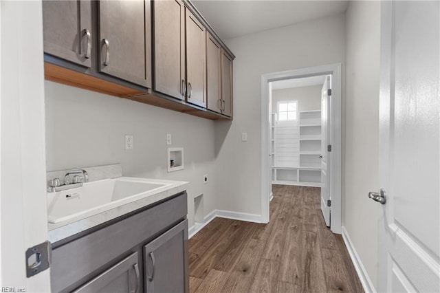242 Quarter Horse Loop, Hertford, NC 27944 - washroom featuring electric dryer hookup, hookup for a washing machine, cabinet space, and dark wood-style flooring