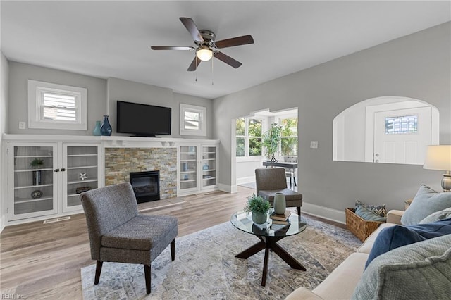 2724 Kimball Ter, Norfolk, VA 23504 - living area with healthy amount of natural light, wood finished floors, ceiling fan, and a stone fireplace