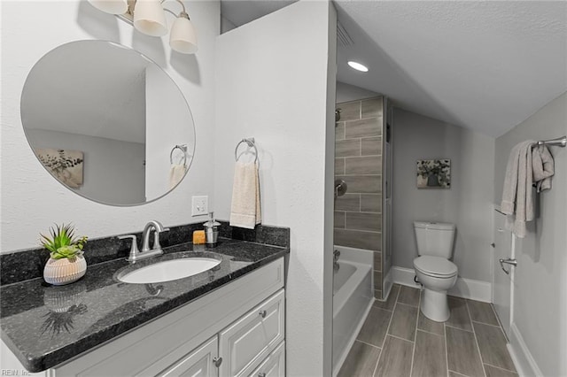 2724 Kimball Ter, Norfolk, VA 23504 - full bath featuring vaulted ceiling, vanity, washtub / shower combination, recessed lighting, and a textured ceiling