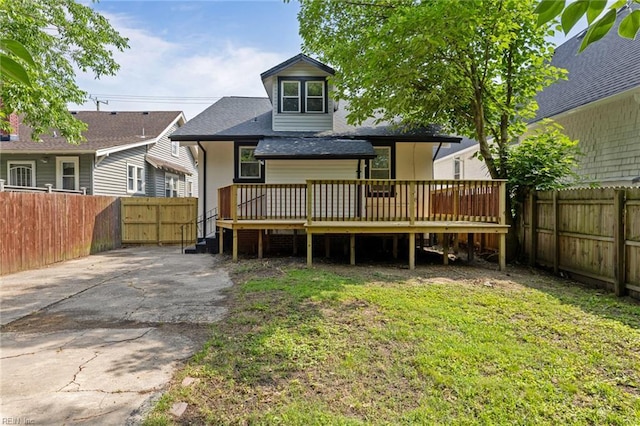 2724 Kimball Ter, Norfolk, VA 23504 - back of property with a wooden deck, a fenced backyard, and a shingled roof