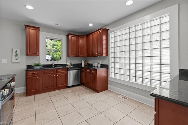 2724 Kimball Ter, Norfolk, VA 23504 - kitchen featuring appliances with stainless steel finishes, recessed lighting, light tile patterned floors, and dark stone counters
