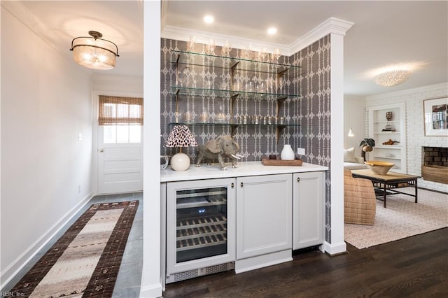 209 44th St, Virginia Beach, VA 23451 - indoor dry bar featuring beverage cooler, built in shelves, ornamental molding, a fireplace, and dark wood-type flooring