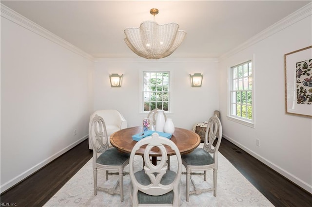 209 44th St, Virginia Beach, VA 23451 - dining room featuring wood finished floors, crown molding, and a chandelier