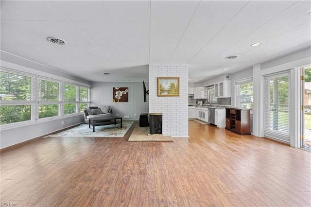 2 Sir Francis Wyatt Pl, Newport News, VA 23606 - living area with healthy amount of natural light, wood finished floors, and a fireplace