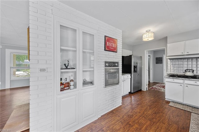 2 Sir Francis Wyatt Pl, Newport News, VA 23606 - kitchen featuring appliances with stainless steel finishes, dark wood-style floors, white cabinets, and light stone countertops