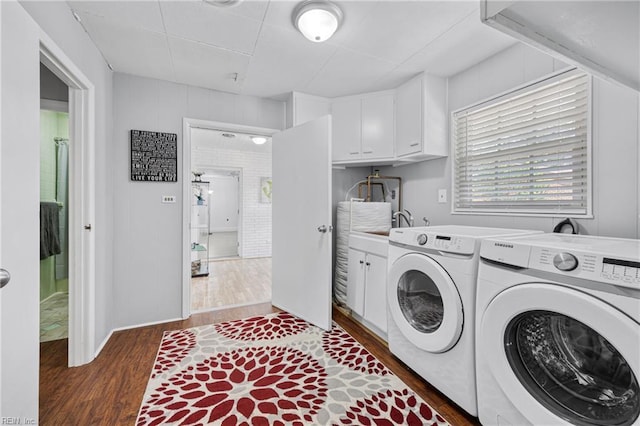 2 Sir Francis Wyatt Pl, Newport News, VA 23606 - laundry area with dark wood finished floors, washer and dryer, and cabinet space