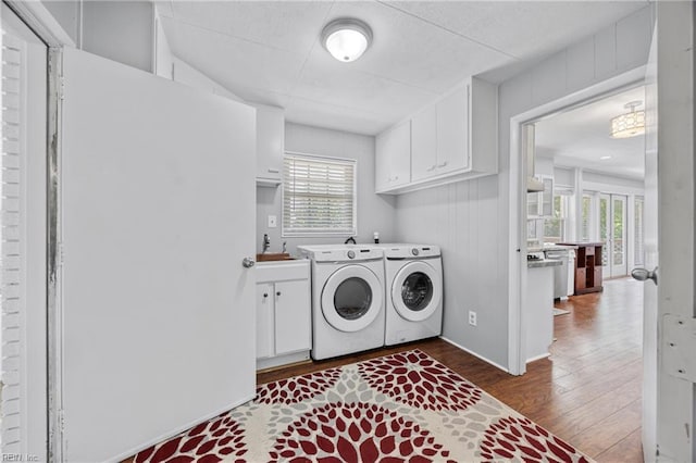 2 Sir Francis Wyatt Pl, Newport News, VA 23606 - laundry room with dark wood finished floors, washer and clothes dryer, and cabinet space