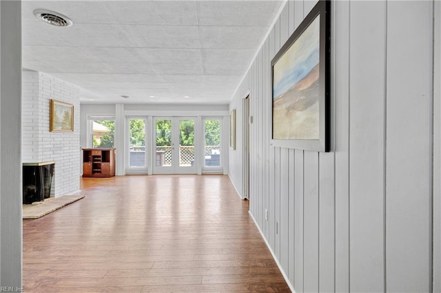 2 Sir Francis Wyatt Pl, Newport News, VA 23606 - unfurnished living room featuring a fireplace and wood-type flooring
