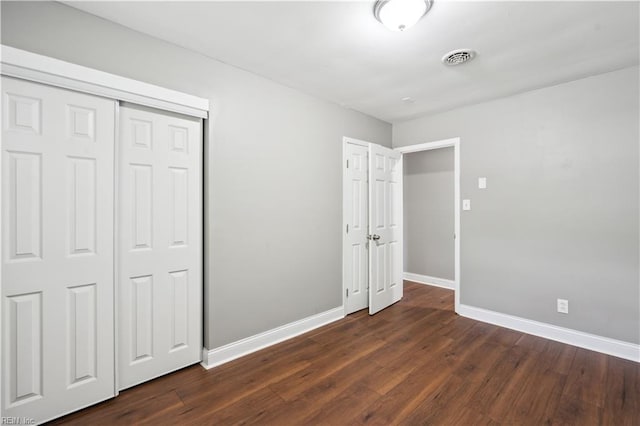 504 Day St, Hampton, VA 23661 - unfurnished bedroom featuring baseboards and dark wood-type flooring