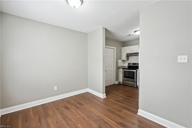 504 Day St, Hampton, VA 23661 - kitchen with stainless steel range with electric cooktop, dark wood-type flooring, under cabinet range hood, white cabinets, and decorative backsplash