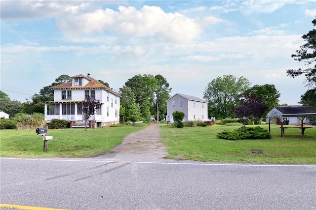 2307 Seaford Rd, Seaford, VA 23696 - view of front of property with a front lawn, driveway, and a sunroom