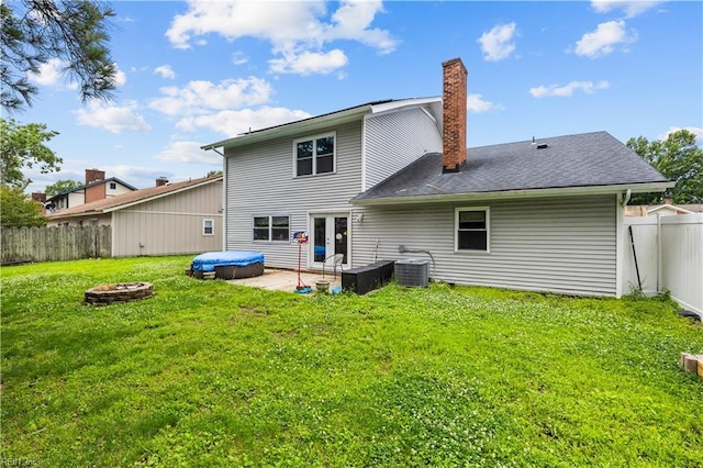 1236 Ginger Crst, Virginia Beach, VA 23453 - back of property with a chimney, a fenced backyard, an outdoor fire pit, and a patio area