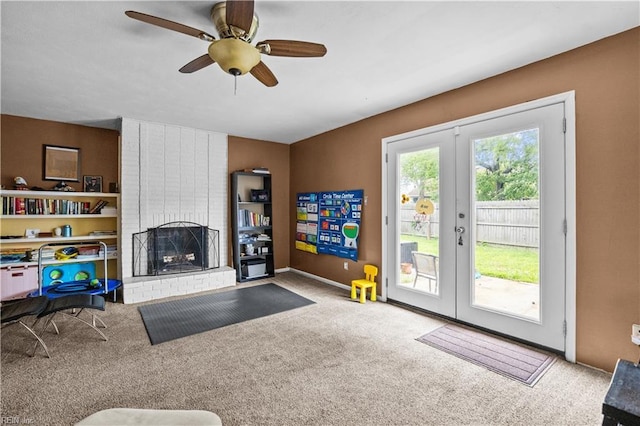 1236 Ginger Crst, Virginia Beach, VA 23453 - living area with french doors, carpet floors, a ceiling fan, and a brick fireplace