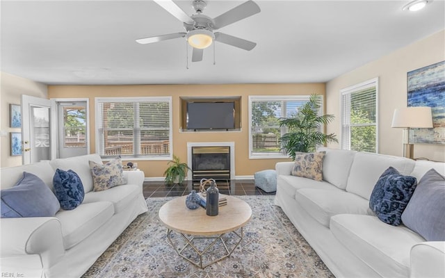 1304 Glen Burnie Ct, Virginia Beach, VA 23454 - tiled living area with a ceiling fan and a fireplace with flush hearth