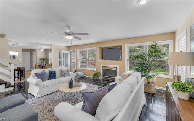 1304 Glen Burnie Ct, Virginia Beach, VA 23454 - living room featuring plenty of natural light, dark tile patterned flooring, a glass covered fireplace, and a ceiling fan
