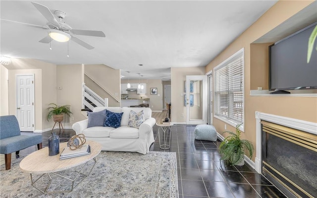 1304 Glen Burnie Ct, Virginia Beach, VA 23454 - living area with a glass covered fireplace, stairs, dark tile patterned floors, and a ceiling fan