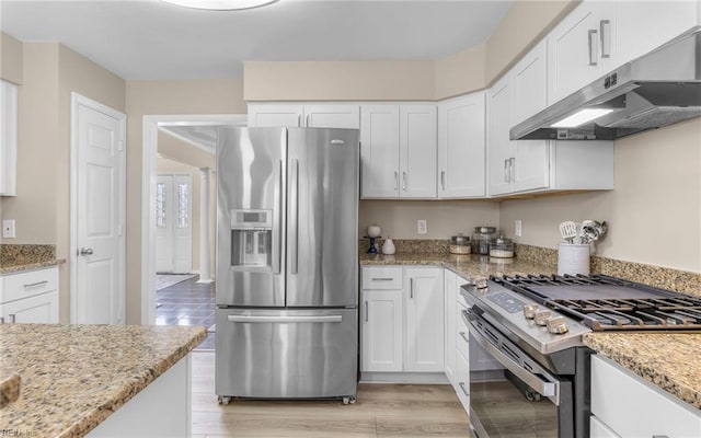 1304 Glen Burnie Ct, Virginia Beach, VA 23454 - kitchen featuring stainless steel appliances, under cabinet range hood, white cabinetry, and light stone countertops