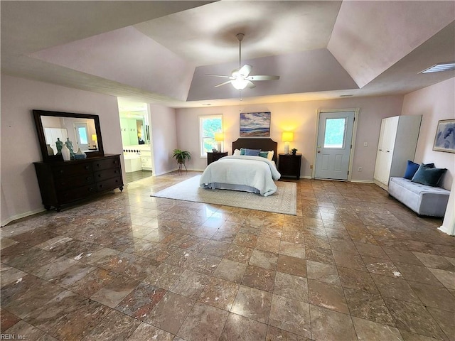 1304 Glen Burnie Ct, Virginia Beach, VA 23454 - bedroom featuring a tray ceiling, stone tile floors, multiple windows, and ensuite bathroom