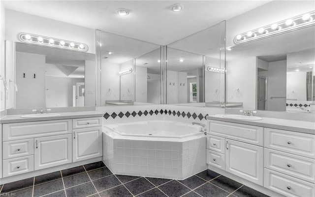 1304 Glen Burnie Ct, Virginia Beach, VA 23454 - bathroom with tile patterned floors, two vanities, and a bath