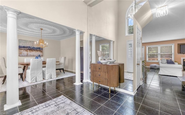 1304 Glen Burnie Ct, Virginia Beach, VA 23454 - foyer entrance featuring decorative columns, a chandelier, and a high ceiling