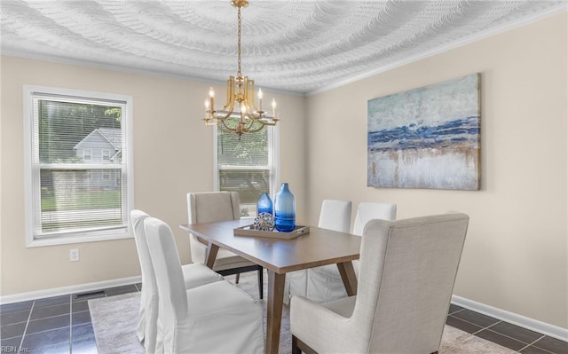1304 Glen Burnie Ct, Virginia Beach, VA 23454 - dining area featuring a chandelier, dark tile patterned floors, and ornamental molding