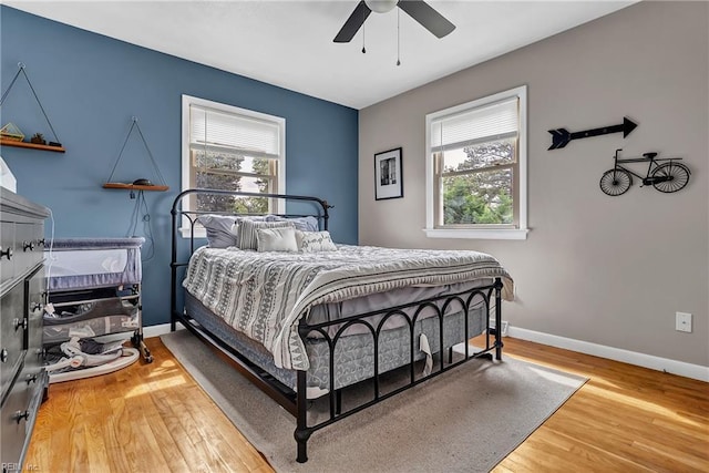 5013 Cay St, Hampton, VA 23605 - bedroom with multiple windows, wood finished floors, and ceiling fan