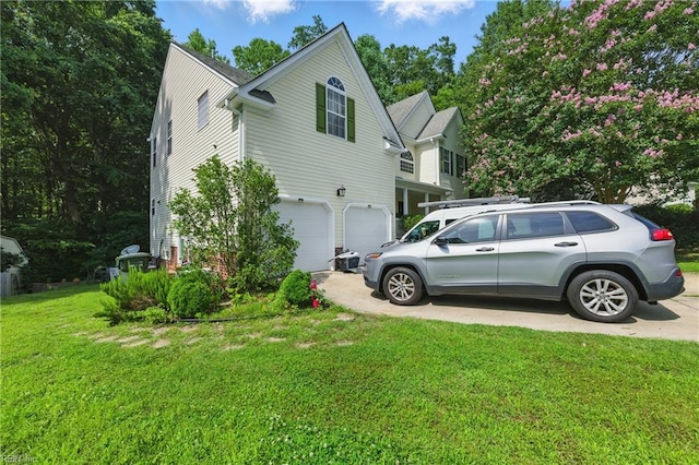 418 Rolling Hills Dr, Williamsburg, VA 23185 - view of side of home featuring concrete driveway, an attached garage, and a lawn