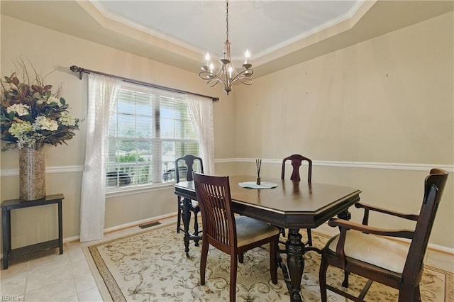 418 Rolling Hills Dr, Williamsburg, VA 23185 - dining space featuring a chandelier, crown molding, a tray ceiling, and light tile patterned floors