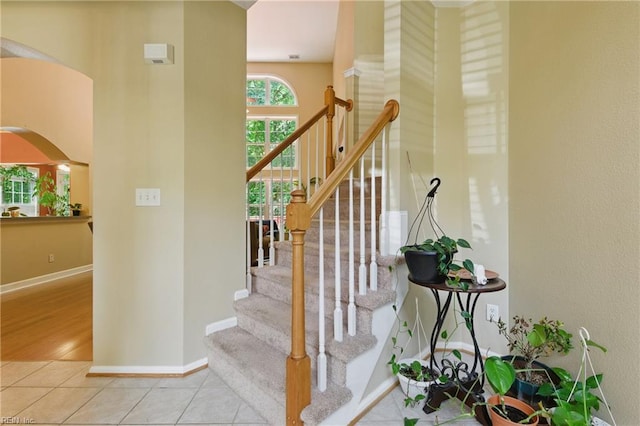 418 Rolling Hills Dr, Williamsburg, VA 23185 - stairway with arched walkways and tile patterned floors