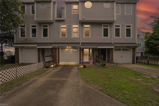 1039 Little Bay Ave, Norfolk, VA 23503 - townhome / multi-family property with brick siding, driveway, and a garage
