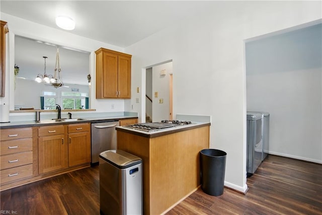 1039 Little Bay Ave, Norfolk, VA 23503 - kitchen featuring stainless steel dishwasher, separate washer and dryer, dark wood-type flooring, and gas cooktop