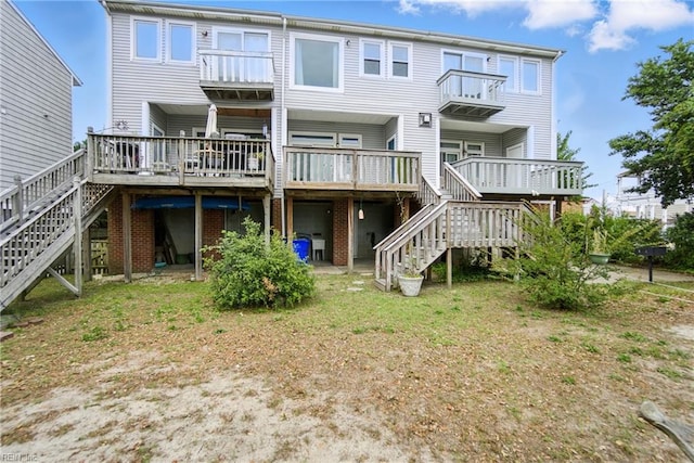 1039 Little Bay Ave, Norfolk, VA 23503 - rear view of property with stairs, brick siding, and a wooden deck