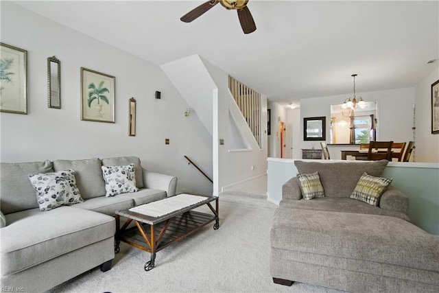 1039 Little Bay Ave, Norfolk, VA 23503 - living area featuring light carpet, ceiling fan, stairway, and a chandelier