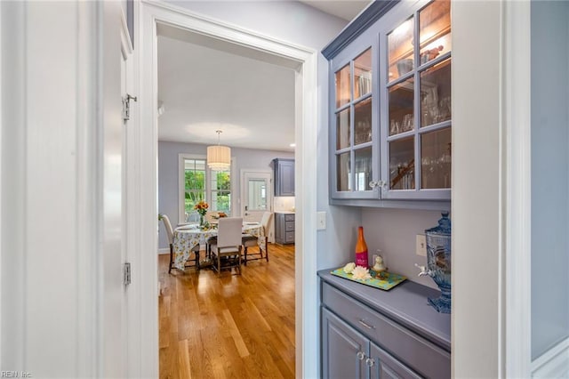 6003 Spinnaker Cove Ct, Suffolk, VA 23435 - bar featuring light wood-type flooring