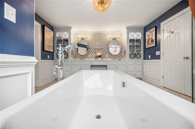 6003 Spinnaker Cove Ct, Suffolk, VA 23435 - bathroom with a decorative wall, a soaking tub, and wainscoting