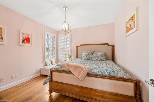 6003 Spinnaker Cove Ct, Suffolk, VA 23435 - bedroom with a chandelier and wood finished floors