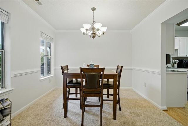 107 Westover Ave Unit 203, Norfolk, VA 23507 - dining space featuring a chandelier, crown molding, and light colored carpet