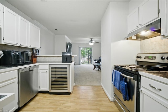 107 Westover Ave Unit 203, Norfolk, VA 23507 - kitchen with appliances with stainless steel finishes, wine cooler, under cabinet range hood, a ceiling fan, and backsplash