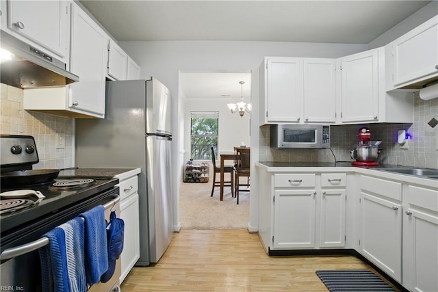 107 Westover Ave Unit 203, Norfolk, VA 23507 - kitchen featuring electric stove, under cabinet range hood, stainless steel microwave, and white cabinets