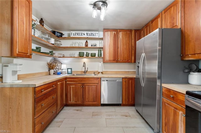 55 Brogden Ln, Hampton, VA 23666 - kitchen featuring appliances with stainless steel finishes, brown cabinets, light countertops, and open shelves